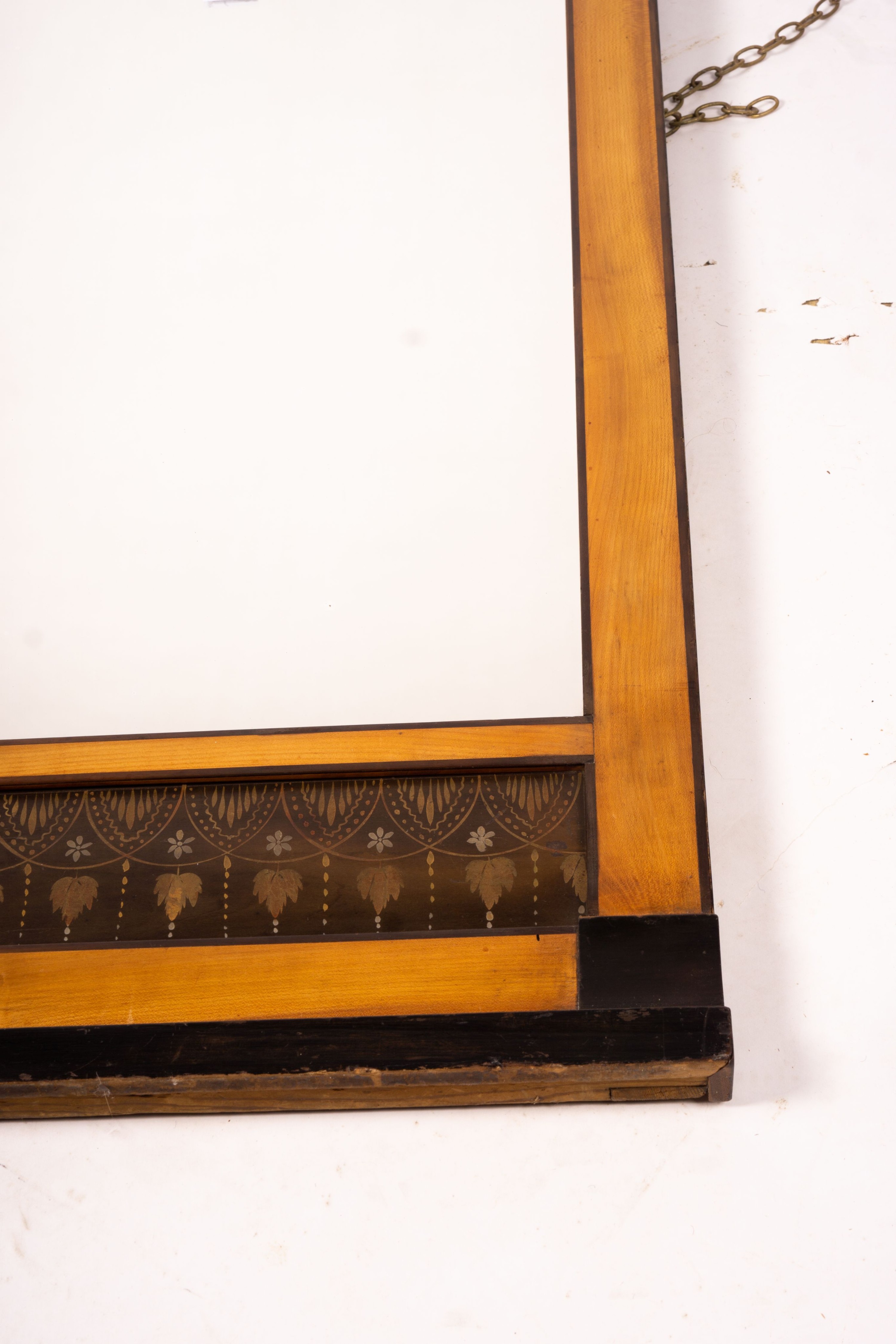 A Biedermeier style mirror with stencil decoration, width 51cm, height 109cm